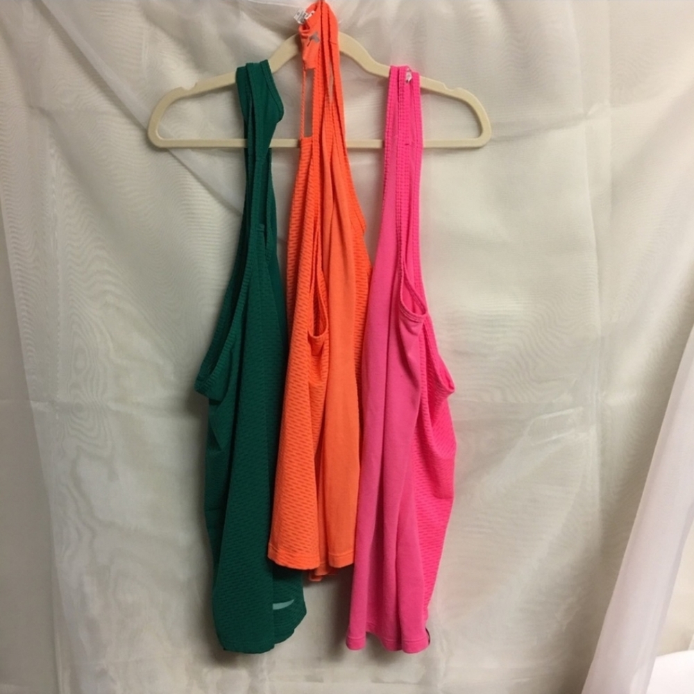 Three Under Armour mesh tank tops in size Large